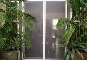 retractable screen doors in use to allow fresh air inside